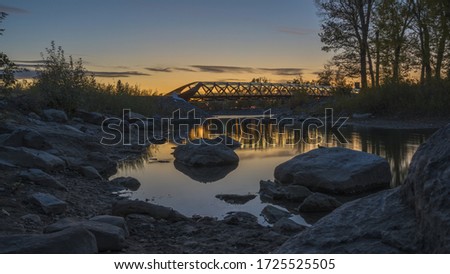 A beautiful view of the Peace Bridge over the river captured in Calgary, Canada