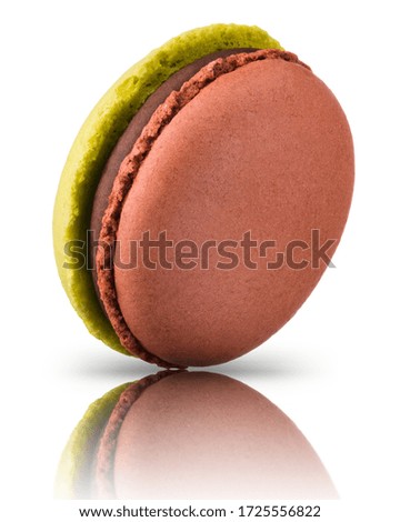 Macro photo of french caramel or chocolate macaroon or macaron isolated on white background