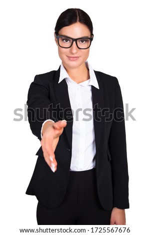 Portrait of beautiful brunette businesswoman wanting to shake hand while standing on white background. Stock photo 