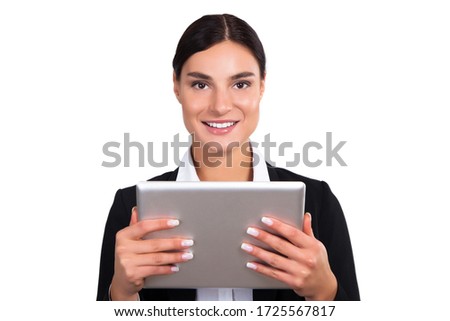Shot of an attractive young businesswoman using  a tablet isolated on white. Stock Photo