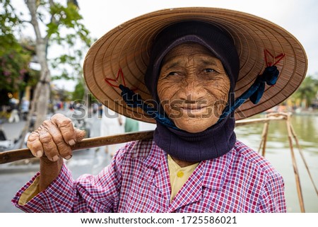 Old woman with straw hat from Vietnam