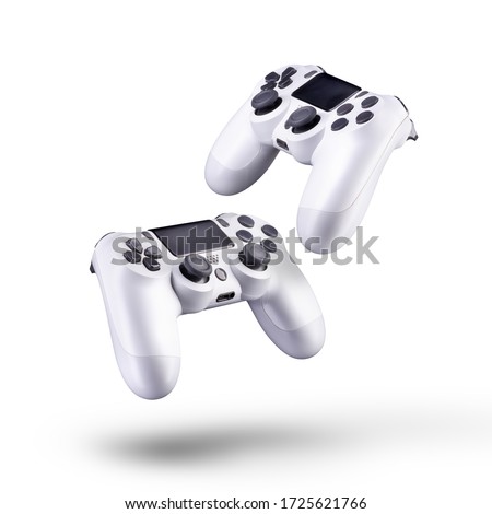 Set of white video game joysticks gamepad isolated on a white background, concept of playing games or watching TV. Royalty-Free Stock Photo #1725621766