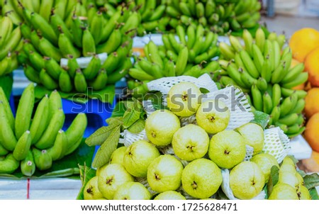 Green guava and banana fruit as Exotic tropical asian food in Hanoi in Vietnam. Street market with Vietnamese cousine. Local produce from garden. Healthy vegetarian stuff. Fruit Royalty-Free Stock Photo #1725628471