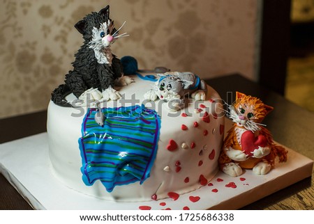 beautiful festive cake with figures of cats