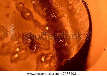 Orange background with black elements. Abstraction with lines and bubbles