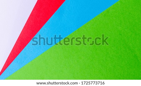 Green, blue, white and red color paper texture background.