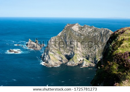 wide angel landscape of mountain ocean and blue sky