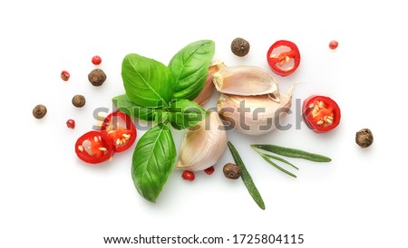 Ingredients for cooking, garlic, pepper, spices and herbs isolated on white background. Top view. Royalty-Free Stock Photo #1725804115