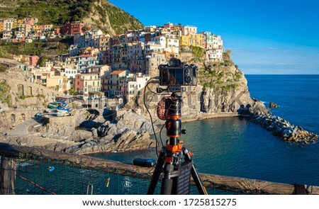 Photographer shooting in Manarola, Cinque Terre, Italy, backstage