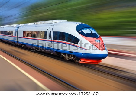 Beautiful photo of high speed modern commuter train, motion blur Royalty-Free Stock Photo #172581671