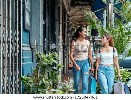 Two girls shopping outdoor stock photo