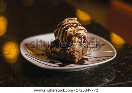 portion of brownie with ice cream