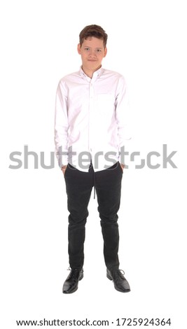 A young smiling teenager standing in the studio with his hands in his
pocket, smiling, isolated for white background

						
						
