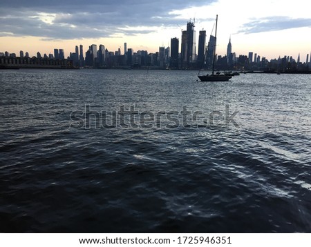 Ship next to New York City Skyline