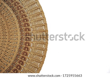 Traditional hand fan with black flowers, isolated on white background                                                  