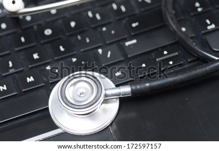 Stethoscope on computer keyboard, concept technology background