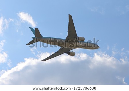 A flying airplane, 777. An aircraft of boeing 777 just got taken off Royalty-Free Stock Photo #1725986638