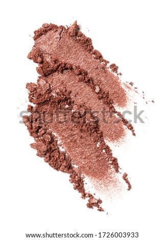 Flat lay of brush strokes. Broken brown color eyeshadow as sample of cosmetic beauty product isolated on white background
