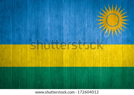 Rwanda Flag on wood background