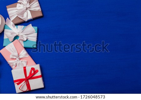 Multi-colored gifts on the birthday party background for inscriptions