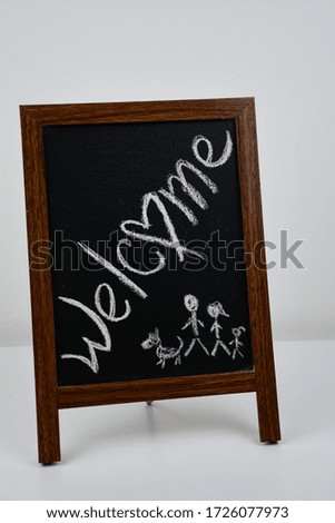 Welcome written on black board