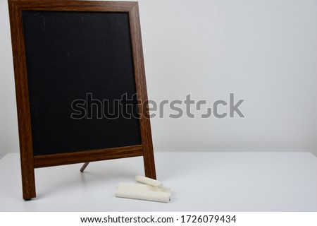 Blackboard background and wooden writing board. 