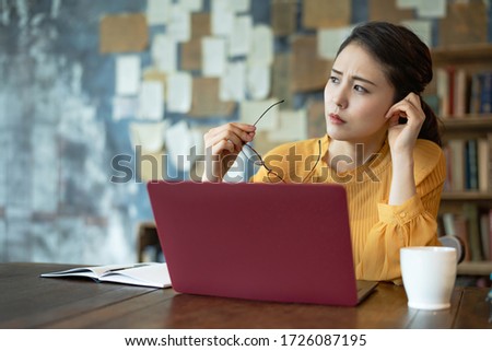 Troubled young asian woman. Remote work. Telework. Royalty-Free Stock Photo #1726087195