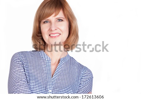 Studio portrait of a gorgeous mature woman smiling at the camera. Isolated on white background.