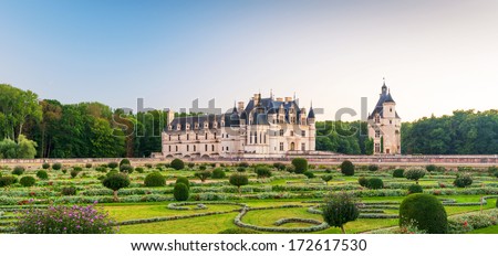 Chateau de Chenonceau in Loire Valley, France. It is landmark of country. Panorama of beautiful castle garden, nice landscape in Loire Valley. Scenic panoramic view of luxury palace at Loire River. 