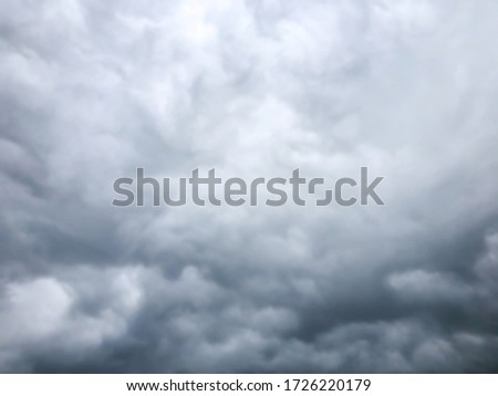 Abstract Blurred Dramatic storm cloudscape Black and White for Nature background, with strange cloud shapes.Soft focus.