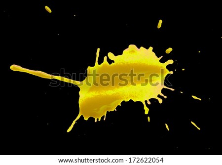 abstract yellow blotch drops on a black background