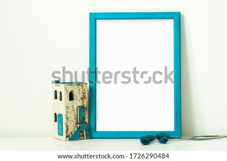 Empty blue photo frame wall poster mockup