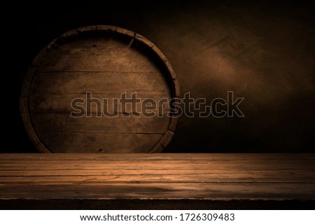 Old wooden barrel on a brown background Royalty-Free Stock Photo #1726309483