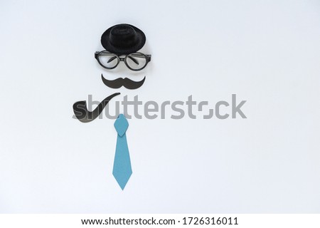 Fathers Day greeting card design for men's event, banner or poster.
Background with mustache, tie, glasses and hat. Space for text. Soft focus. Top view.