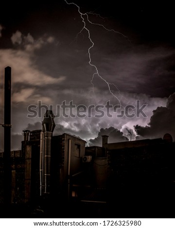Electrical storm with skyline, urban dark mood scene.