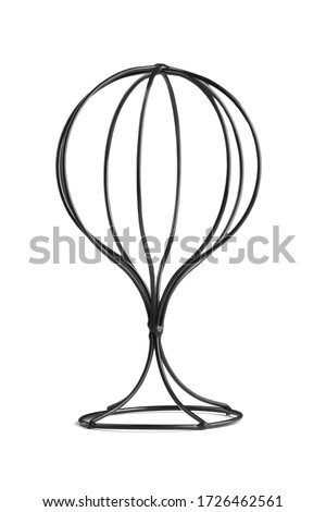 Subject shot of a black metal stand for wigs and hats. The accessory for headwear care is isolated on a white background.   Royalty-Free Stock Photo #1726462561