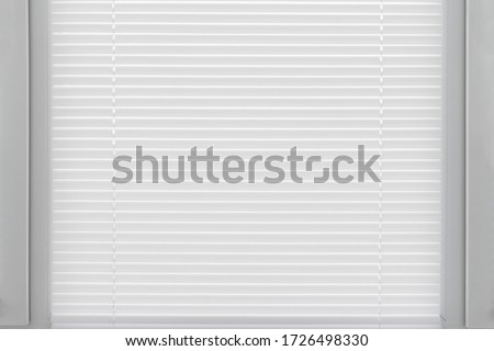 Window from the slats white venetian blinds. Decoration interior of room. Royalty-Free Stock Photo #1726498330