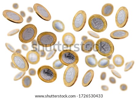 one brazilian real coins falling on isolated white background. Coin rain with blur effect, concept of grand prize, draw, lottery.
