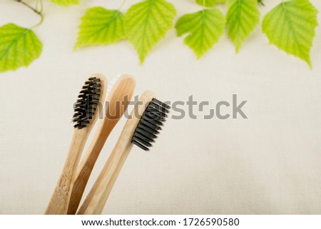 Eco-friendly bamboo toothbrush. Pastel background. Zero waste, life without plastic.