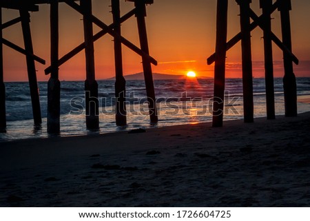 Blue and orange sunset sky over Pacific Ocean in Newport Beach, California