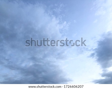 Fluffy soft black cloudy against sky before to rainy. Atmosphere
of overcast sky. Circle space in cloudy sky pattern.