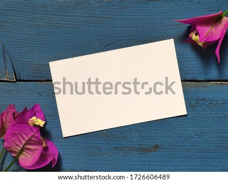 Business card mockup on blue wooden backdrop