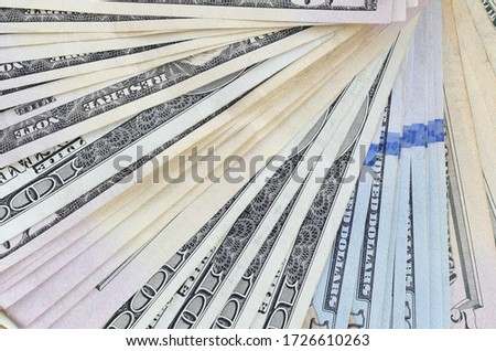 Fan of many one hundred and fifty dollar bills on wooden background surface close up. Flat lay top view. Abstract business concept