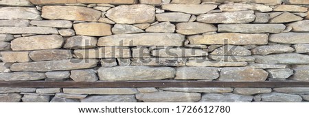 Texture of a stone wood wall. Old castle stone wooden wall texture background