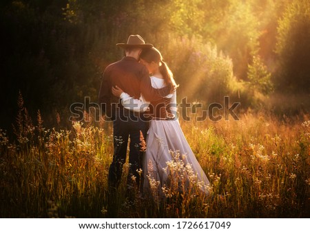 Beautiful American couple in autumn sunset