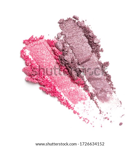 Flat lay of brush strokes. Broken bright pink and purple eyeshadow as samples of cosmetic beauty product isolated on white background