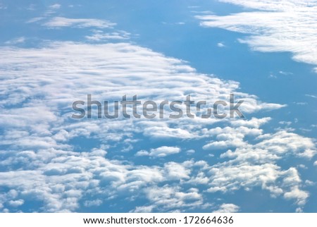 view of clouds from an airplane window, background