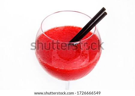 Close up of red alcohol beverage on white background