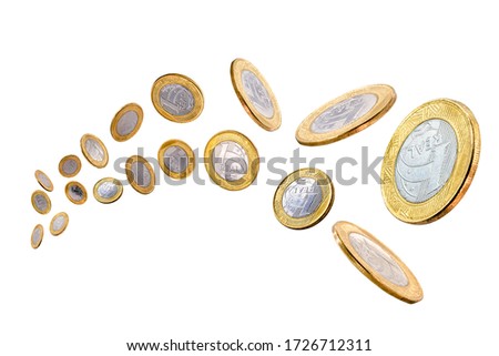 Brazilian real coins one falling isolated on white background, concept of luxury or Brazilian economy.