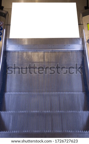 White blank advertise area on the escalator. Escalator banner mock up on the floor.